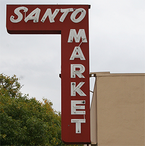Santo Market's vintage red corner sign